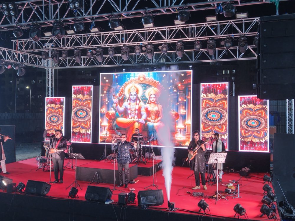 Live bhajan performance with a Ram Darbar LED backdrop and stage effects